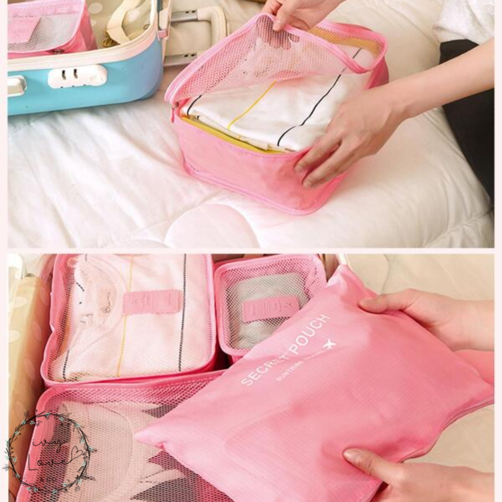 A photo of blue and pink packing cubes for children's clothes